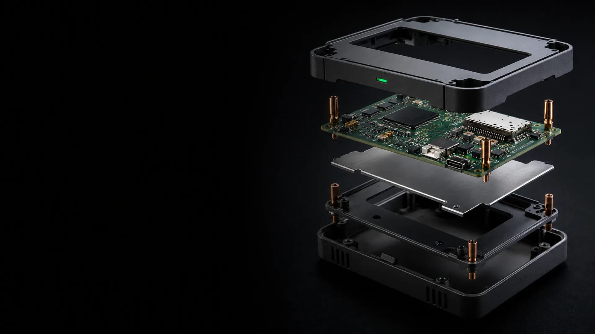 Exploded embedded system concept showing enclosure, populated PCB, thermal spreader, and production housing